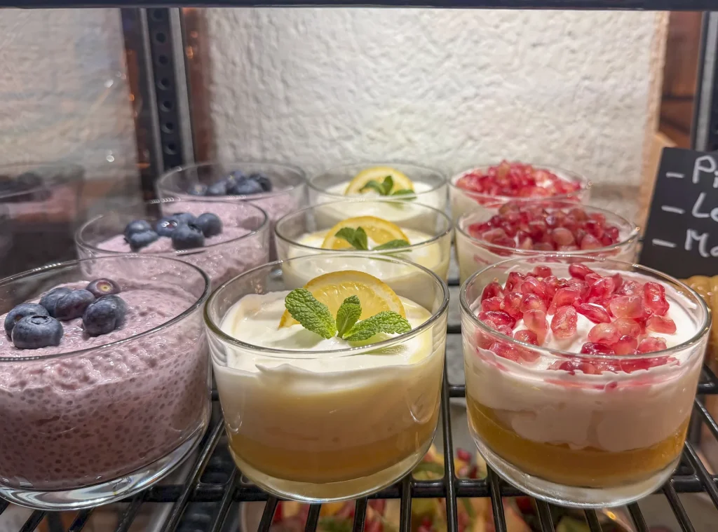 Glass portions of yoghurt with berries and fruit at the Alpenhof breakfast buffet