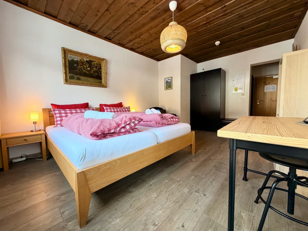 Bedroom in Room 6 at Hotel Alpenhof