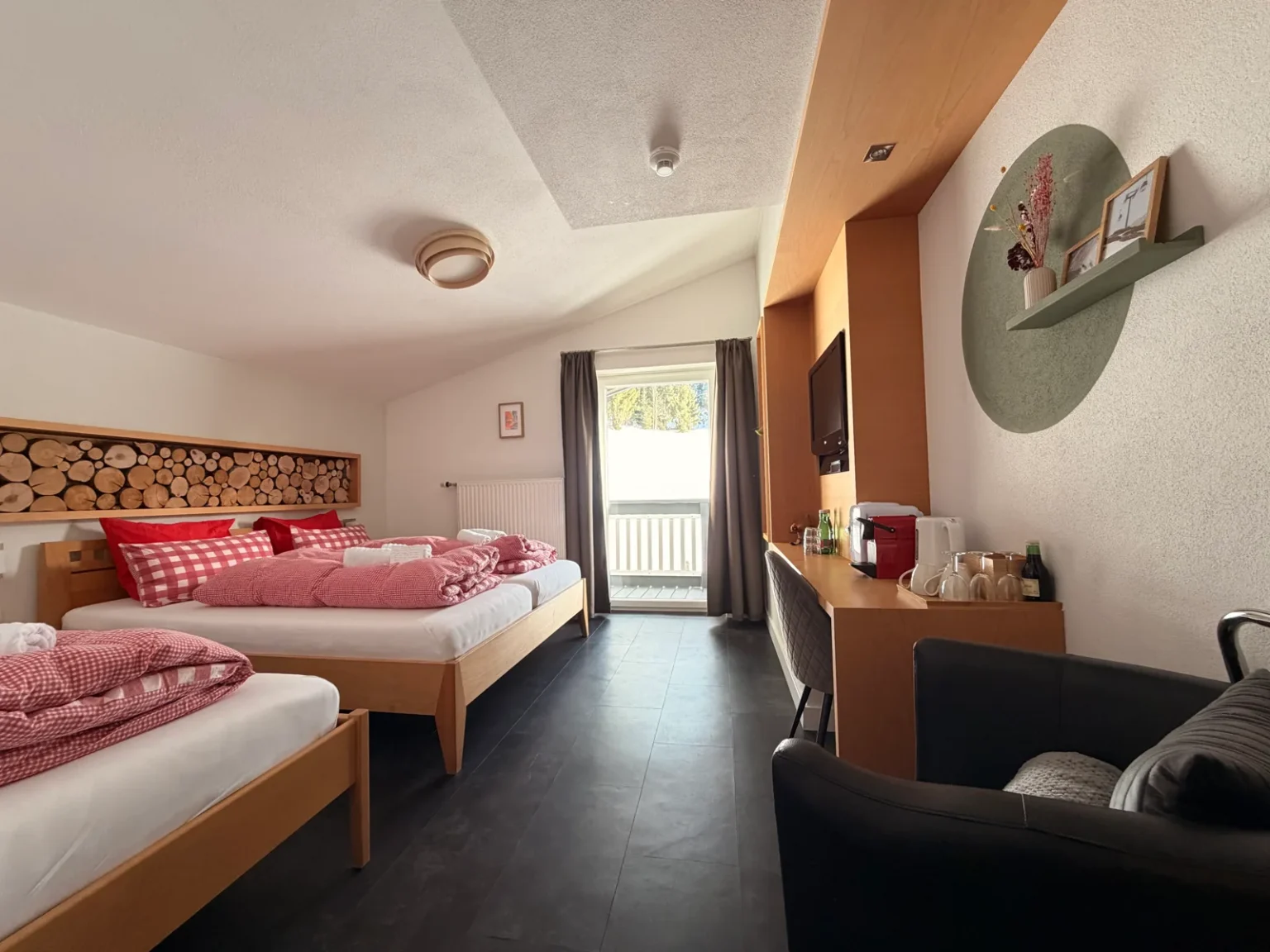 Bedroom with wooden furnishings in Room 09 at Hotel Alpenhof