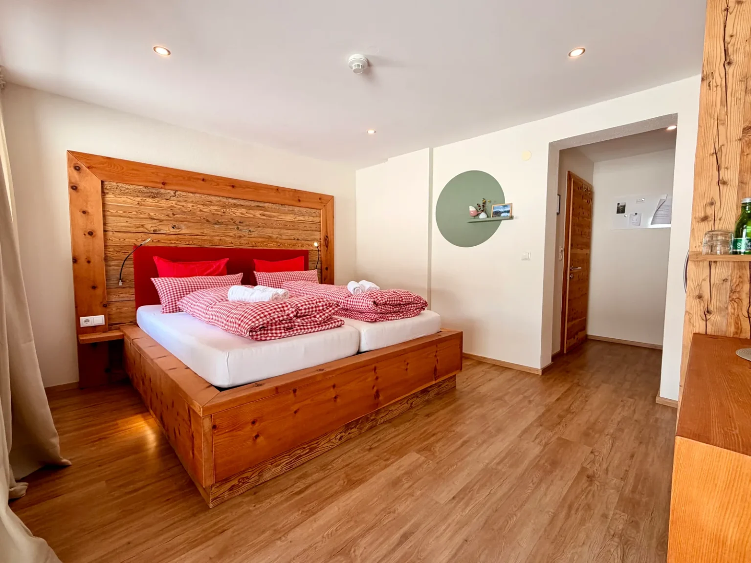 Bedroom with wooden furnishings in Room 11 at Hotel Alpenhof
